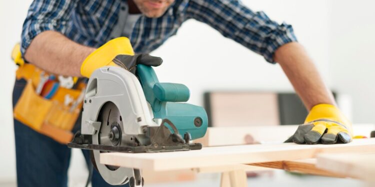 carpenter working with circular woodworking