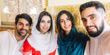 group-friends-taking-selfie-arab-restaurant-languages