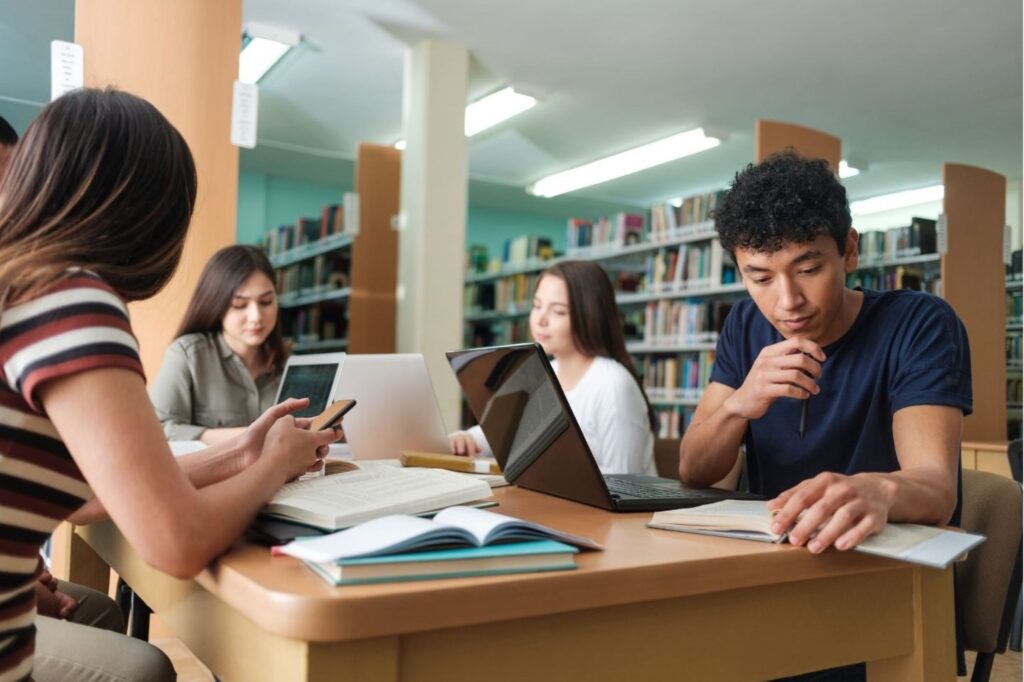 Students studying in supervised school library school break students safety policy midday