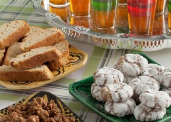 Ghriba almond cookies with characteristic cracks and mint tea Moroccan pastry traditional sweet honey