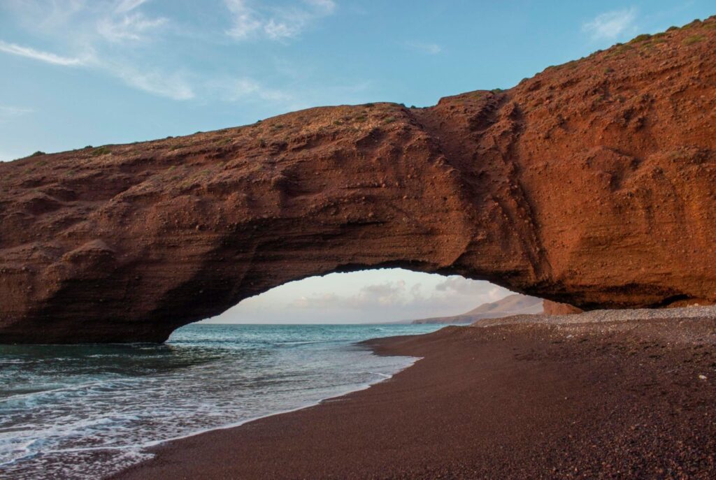 Natural sandstone arch at Legzira beach Morocco coastal gems hidden Atlantic beach discover