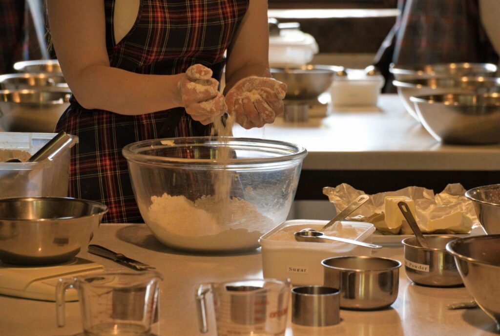 Woman preparing traditional Moroccan pastries in home kitchen Moroccan pastry traditional sweet honey