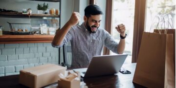 Moroccan tech entrepreneur working at startup office in Casablanca representing tech success stories of professionals building internationally-competitive companies contributing to Morocco Digital 2030 goals