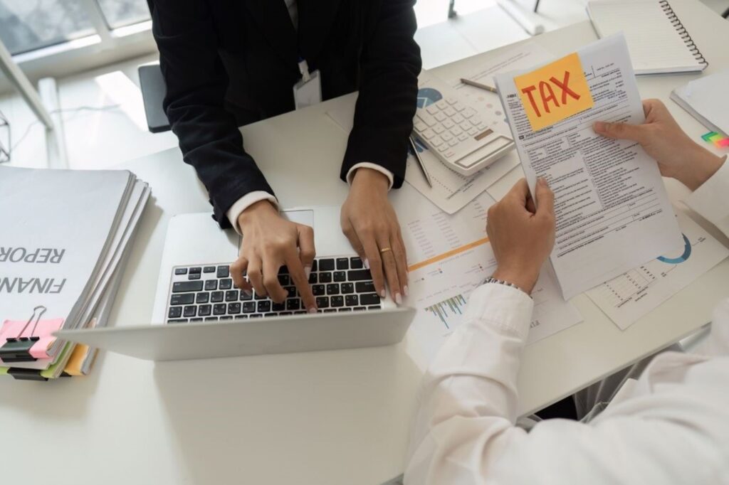 Organized business expense receipts and invoices for Morocco year-end tax deductions and documentation, showing proper record-keeping for Direction Générale des Impôts filing requirements and audit compliance