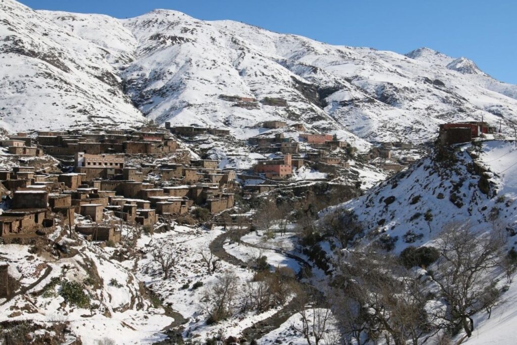 Atlas Mountains trekking routes passing through traditional Berber villages in Morocco winter