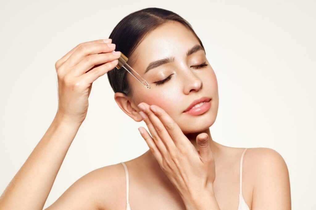 Moroccan skincare secrets with woman applying argan oil for natural beauty benefits