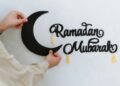Moroccan preparing Ramadan with traditional mosque decorations and spiritual planning atmosphere