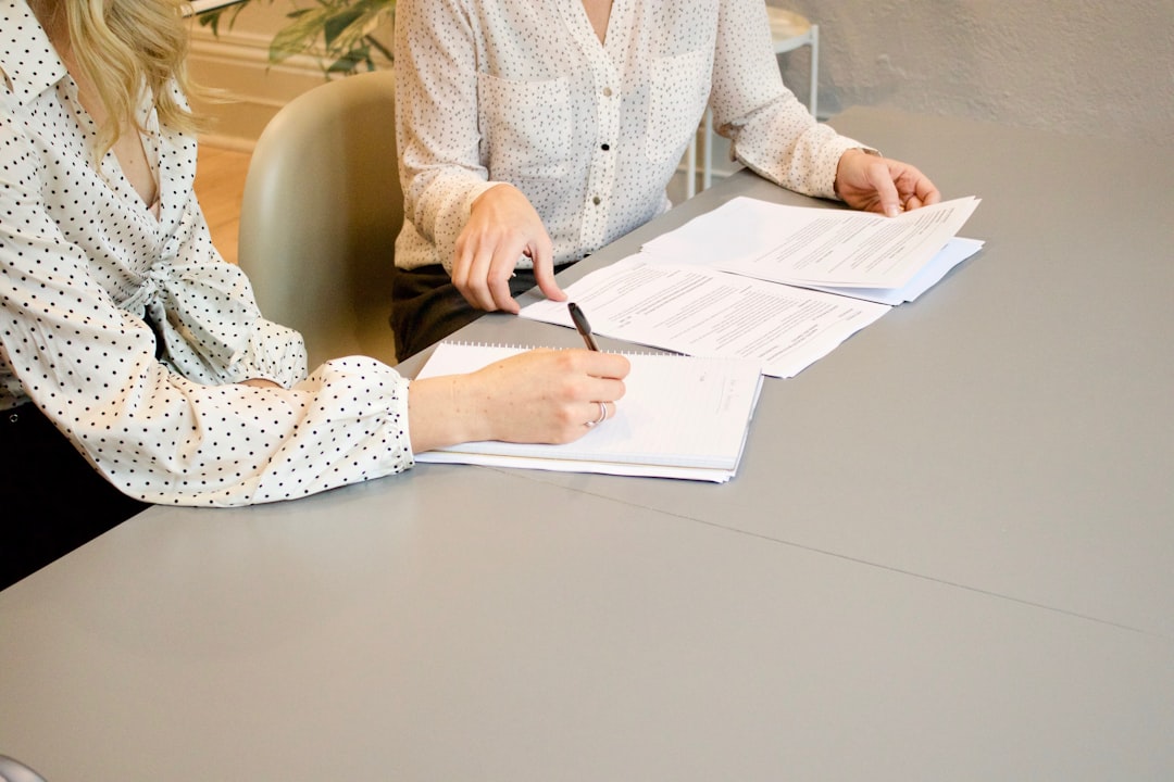 A consultant and client signing an agreement to operate within Morocco's free trade zones