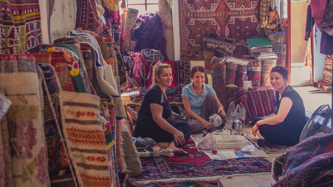 An artisan embroiders fabric in a Moroccan workshop, and the craft that Moroccan designers use to create the collections.