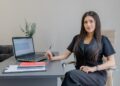 A professional reviewing an employment contract while hiring local talent in Morocco at a modern Casablanca office