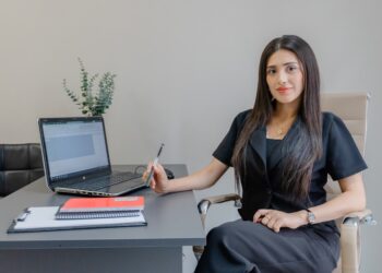 A professional reviewing an employment contract while hiring local talent in Morocco at a modern Casablanca office