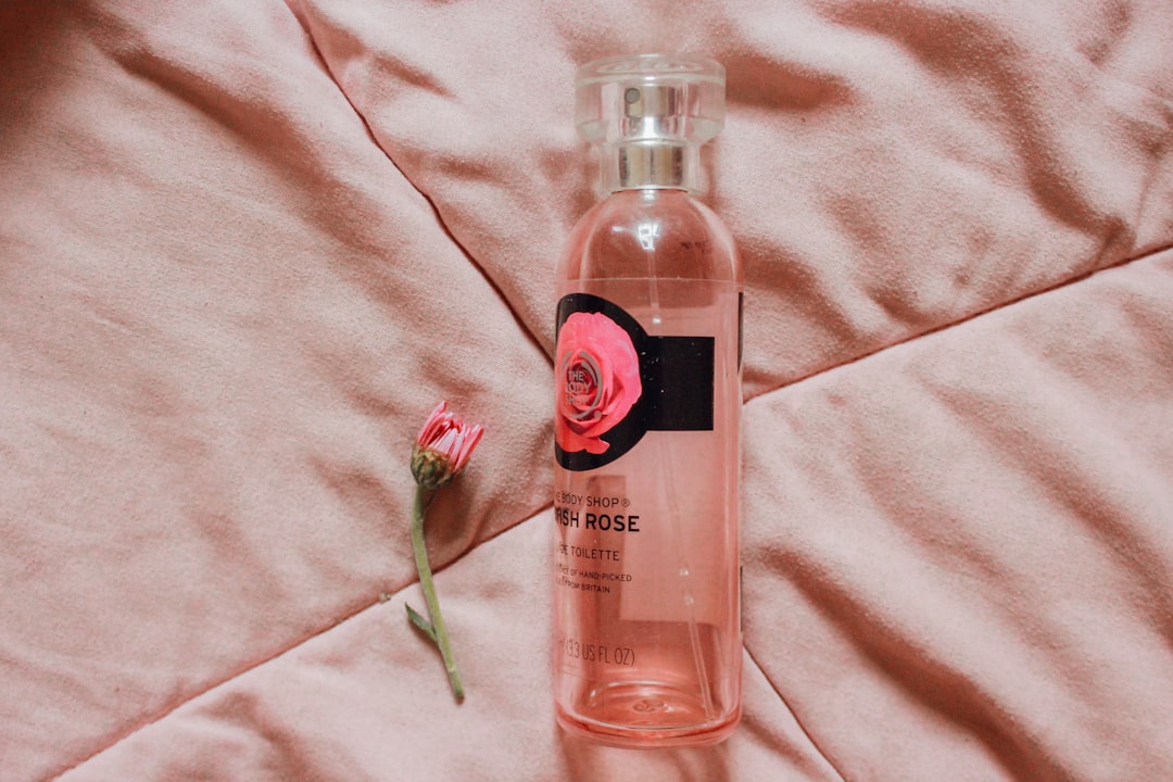 A Moroccan woman using rose water toner in a natural Moroccan beauty routine at home