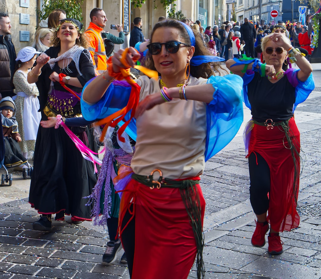 A performer in traditional Moroccan costume taking part in a street parade during Fête du Trône celebrations