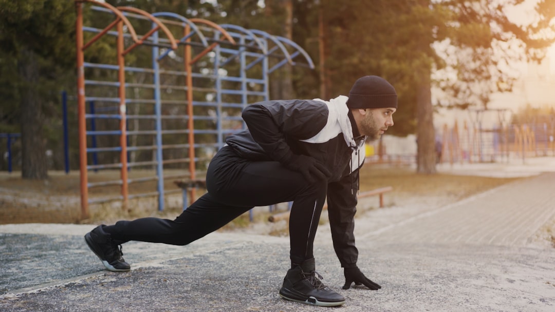 An athlete preparing for competition at a Moroccan athletics club stadium event