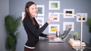 A businesswoman reviews wealth management data at her desk inside a Casablanca Finance City tower office