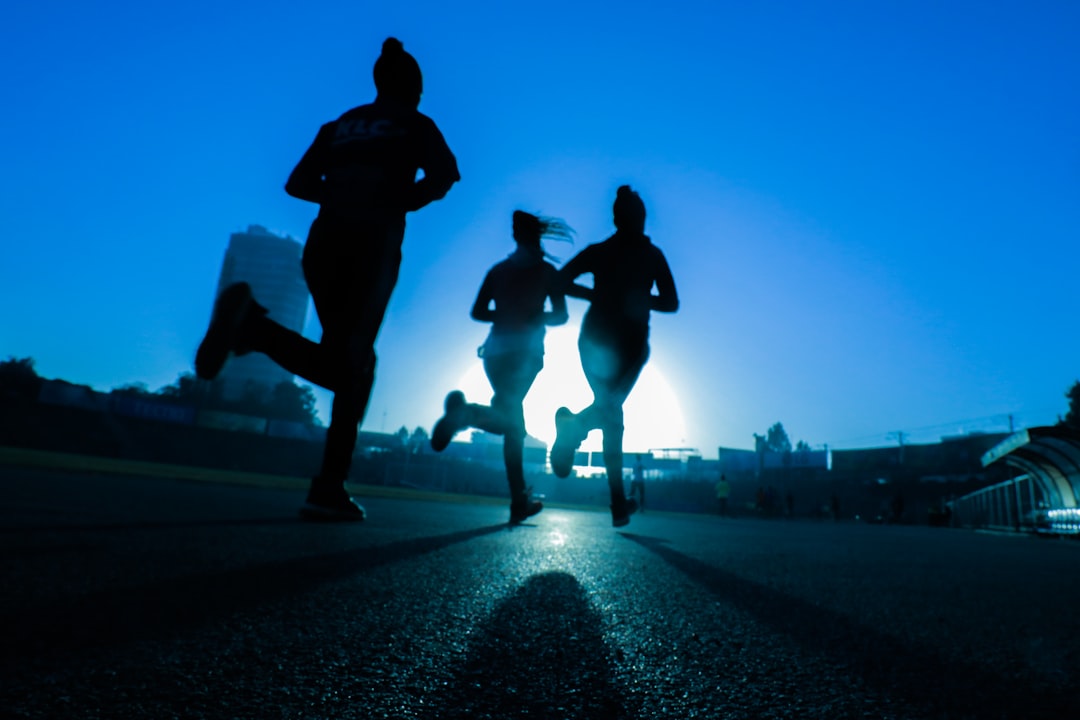 A group of runners from a Moroccan athletics club completing a road training session together