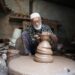 moroccan-pottery-craftsman-unsplash - MAwebzine A Fassi artisan demonstrates Moroccan pottery hand-throwing technique on a foot-powered wheel in Ain Nokbi
