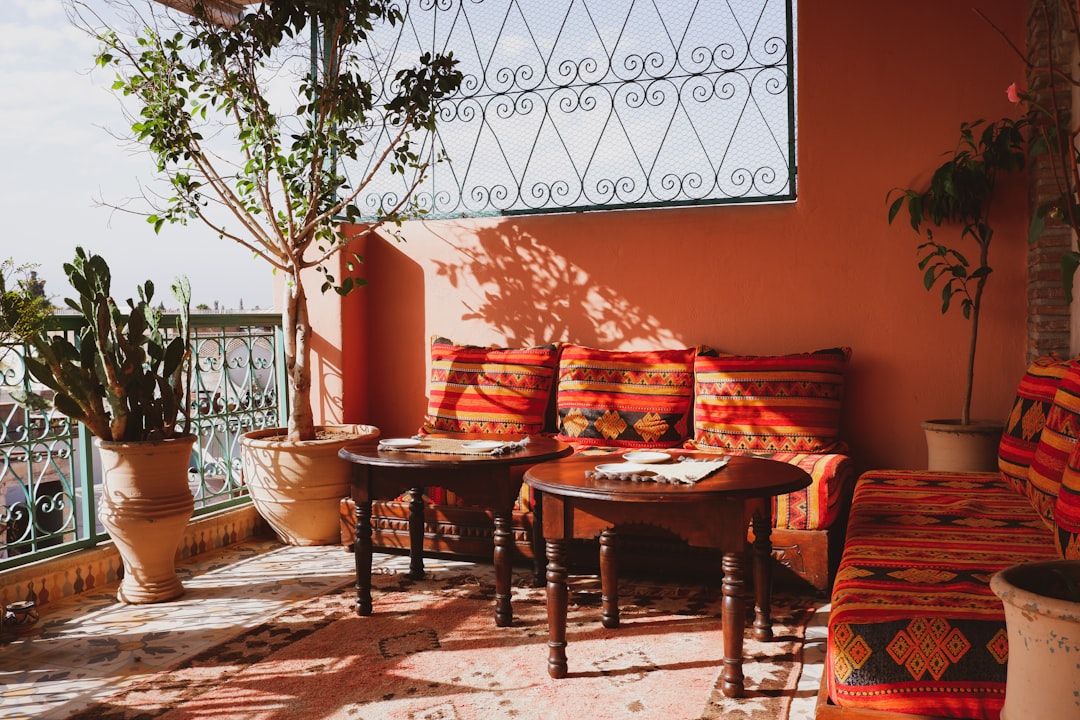 A visitor relaxes on a riad rooftop terrace inside a Morocco medinas district as the evening cools in September