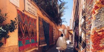 moroccan-artisan-souk-workshop-unsplash - MAwebzine A craftsman works leather goods inside a souk in one of Morocco's historic medinas during the autumn season
